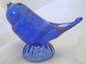Blue Glass Bird with ashes in the bases